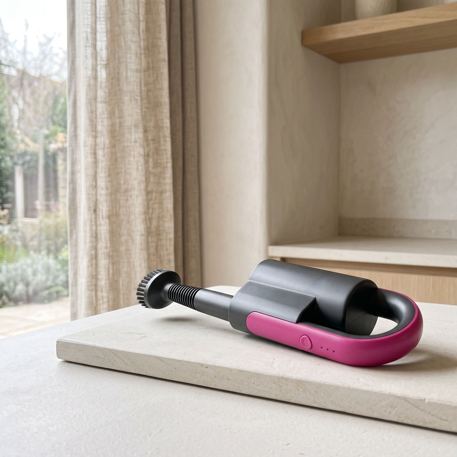 Handheld steamer on a counter in an illustrative setting